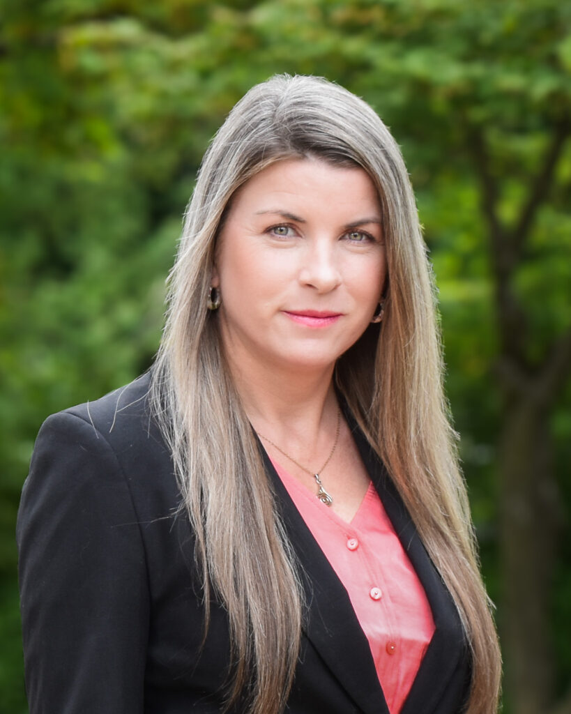 Headshot photo of Andrea